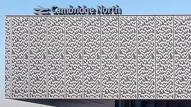 Cambridge North station, its facade patterned with the Rule 30 cellular automaton